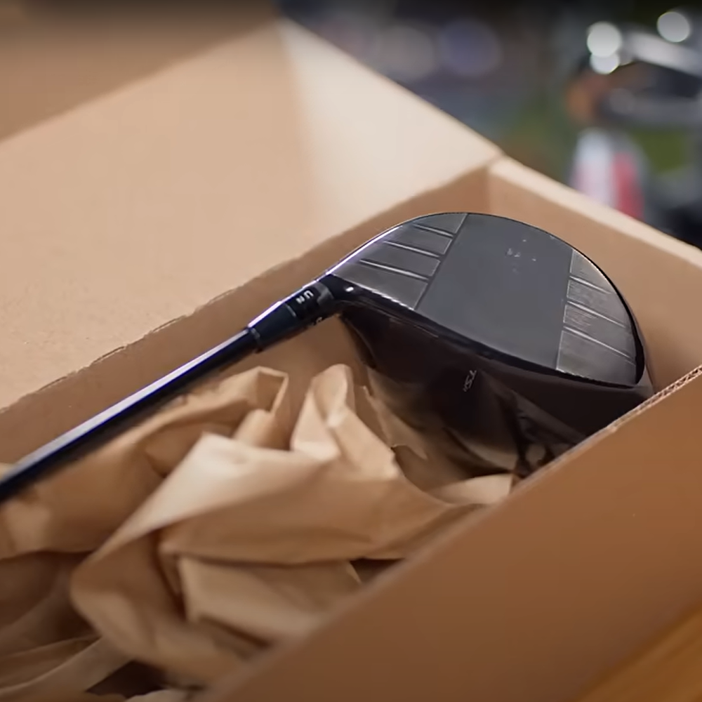 image of a club being packed in a box