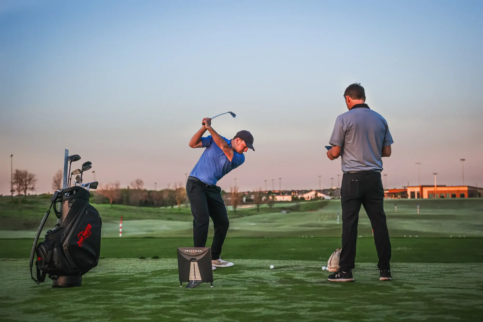 a man golfing outdoors at the pga coaching center